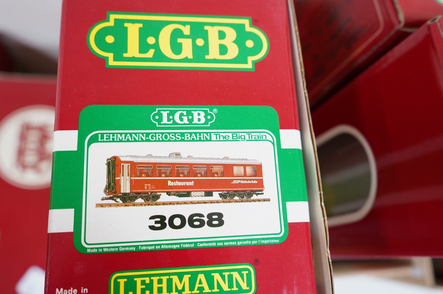 Three boxed LGB G scale Continental outline RhB bogie coaches; a Full First (30650), a restaurant car (3068), and another Full First (3067). Condition - good.